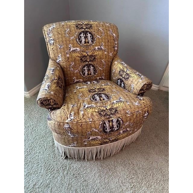 This statement piece is a luxury occasional chair characterized by its rich, decorative velvet upholstery featuring...