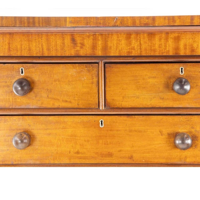 A handsome early 19th-century figured mahogany chest of drawers, distinguished by beautifully selected veneers,...