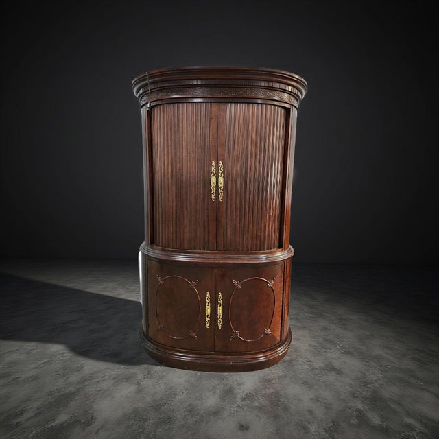 A stunning Century Furniture curved-front mahogany armoire or bar cabinet, featuring elegant tambour doors, brass...