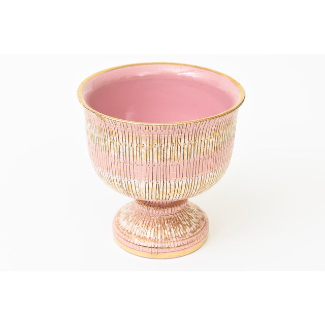 This vintage Italian 1960's ceramic pedestal bowl by Aldo Londi for Bitossi is of the seta technique. The colors are pink,...