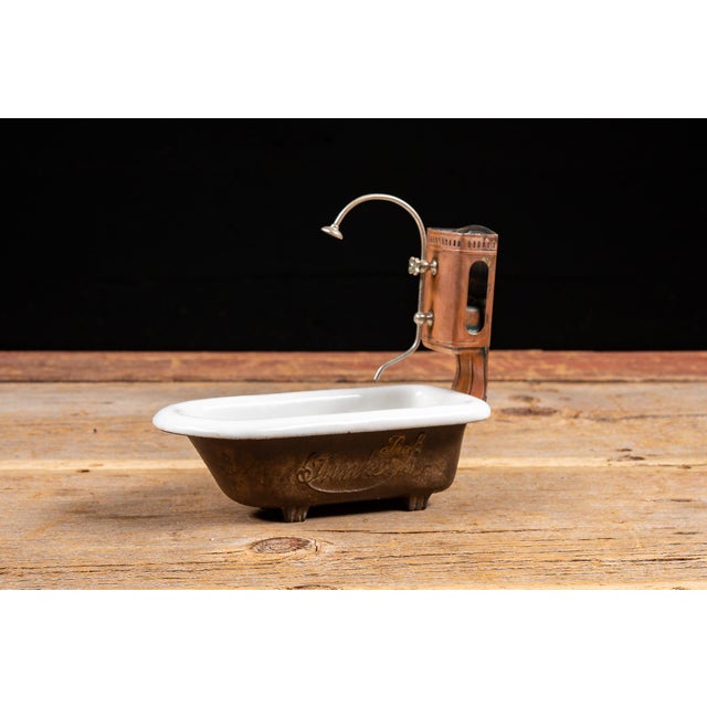 c. 1905; mfd. by Gebrüder Bing for Junkers & Co. - Hirzenhain, Germany Miniature cast-iron and enamel bathtub fitted with...