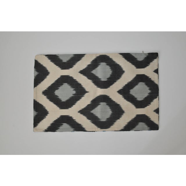 Beautiful black, ivory, and blue geometric silk velvet accent pillow with a different silk design on the back. It's like...