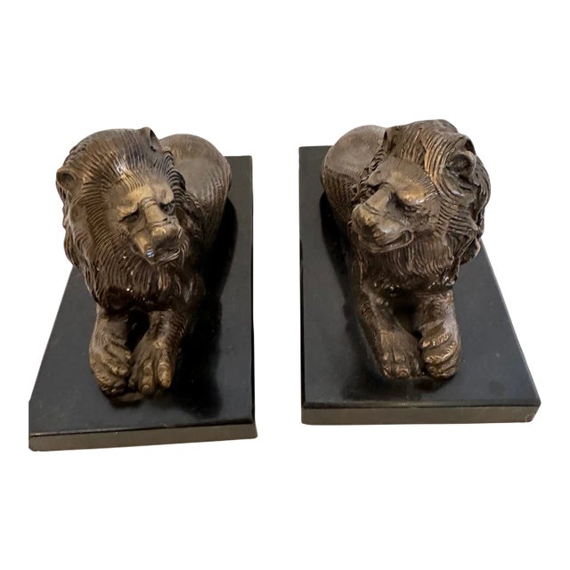 Bookends Having Recumbent Bronze Lions on Belgian Slate Bases -A Pair For Sale