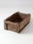 This antique wood farm crate, circa 1920s, features a long rectangular form crafted from rough-hewn boards with exposed...