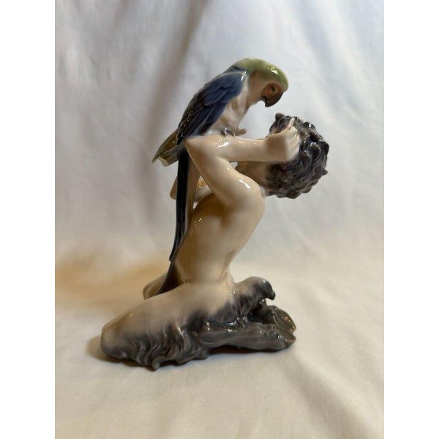 As Found -Authentic vintage Royal Copenhagen porcelain figurine, titled 'Faun with Parrot' (model #752). This piece was...