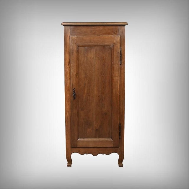 This small solid oak armoire exudes a restrained and refined presence, enhanced by the natural warmth of the wood and the...