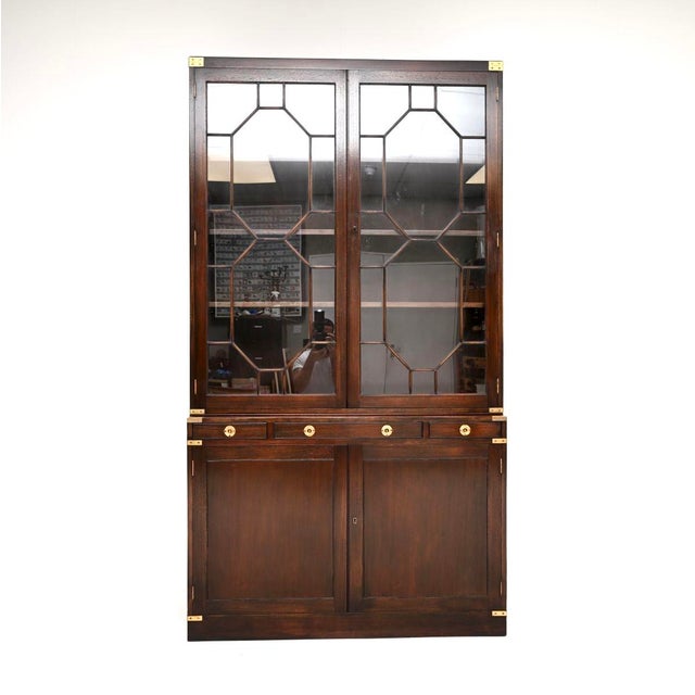 A superb antique military campaign style bookcase, made in England and dating from around the 1950’s. This is of amazing...
