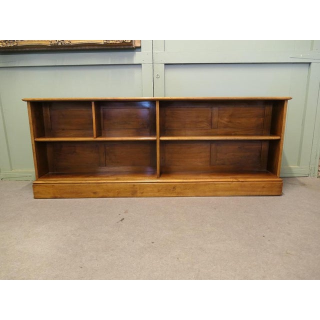 Long 1920s Open Front Golden Walnut Bookcase This Long 1920s Open Front Golden Walnut Bookcase has been hand made, it has...