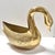 Elegant and sculptural, this vintage brass swan features a gracefully arched neck, finely detailed featherwork, and a warm...
