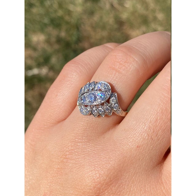 The Adelaide: Antique Cocktail Ring with Diamonds. The ring features a section of three transitional cut round diamonds in...