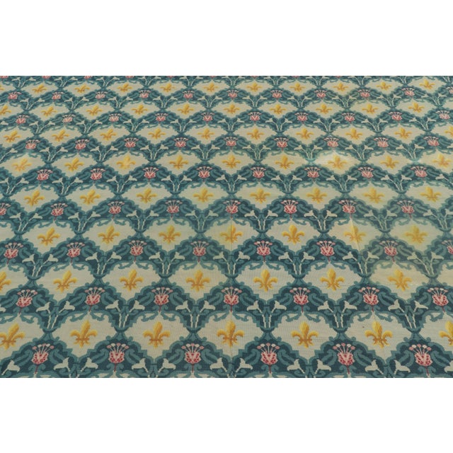 Handmade in wool, this 7x9 antique Aubusson tapestry is a refined example of late 19th-century French textile design....