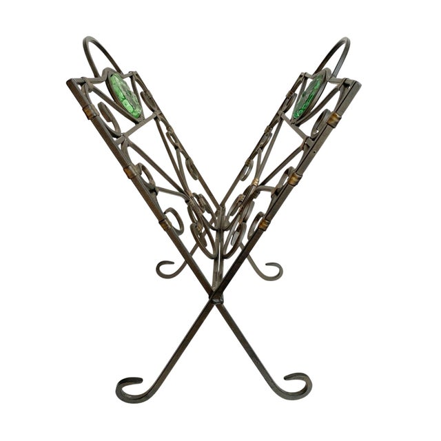 Elevate your home decor with this Folding Magazine or Record Holder, featuring an elegant green glass medallion that adds...