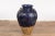 A large antique Thai cobalt blue glazed Martaban jar from the 19th century, with petite swan neck loops, raised dragon...