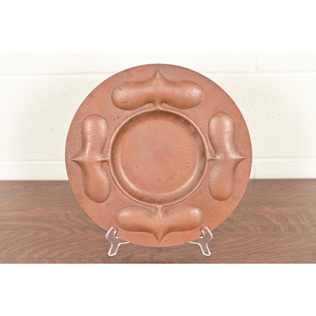 A gorgeous Arts & Crafts hammered copper charger plate or tray In the manner of Roycroft By Ramon Ramirez Mexico, Mid-20th...
