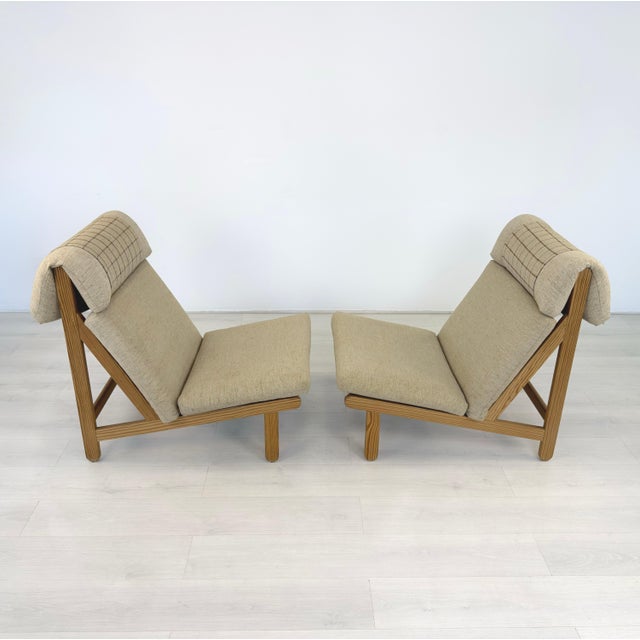 Dimensions: H 35” x W 27” x D 40” x SH 16” Pair of Vintage Danish pine lounge chairs designed by Bern Petersen in the...