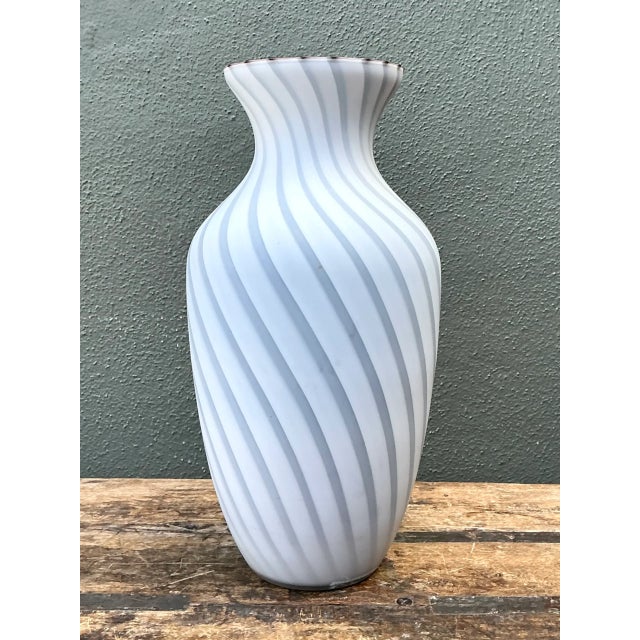Attributed to Archimede Seguso, this vintage Murano glass vase showcases the refined craftsmanship of mid-20th-century...