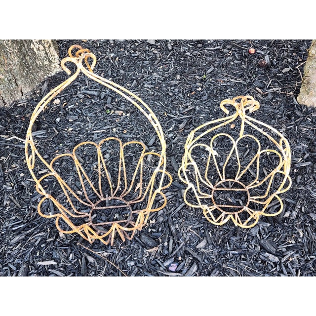 These are two charming vintage solid wrought iron planters. Feature scalloped basket design in gradual sizes. They are in...