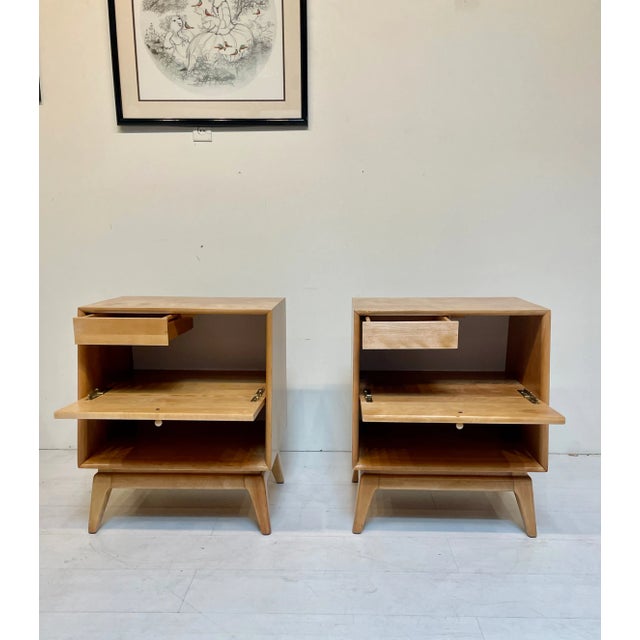 This pair of night stands is in the Encore series from Heywood Wakefield, from 1955-6. Drop front conceals storage space...