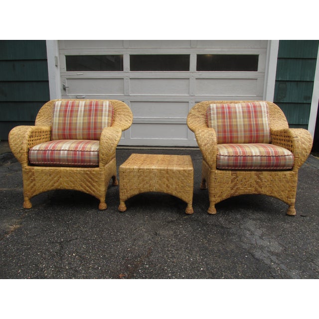 Pair vintage lounge chairs and ottoman by McGuire. Beautifully constructed of woven rattan with bamboo frames. Chairs and...