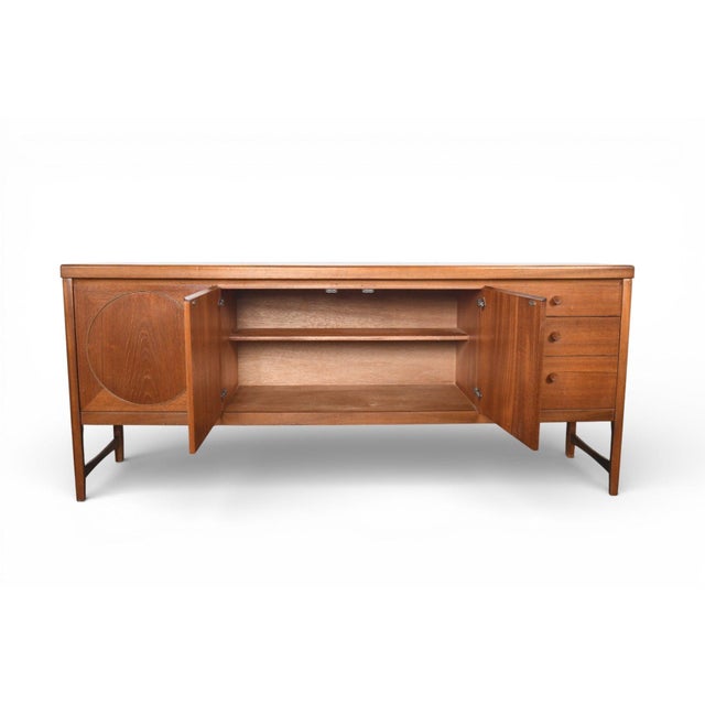 Origin: England Designer: Patrick Lee Manufacturer: Nathan Era: 1960s Materials: Teak Measurements: 72″ wide x 18″ deep x...