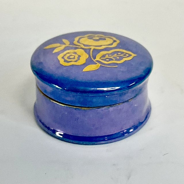 Vintage Home is pleased to offer this pretty Art Deco style German Porcelain Trinket Box. It’s a beautiful blue with gold...