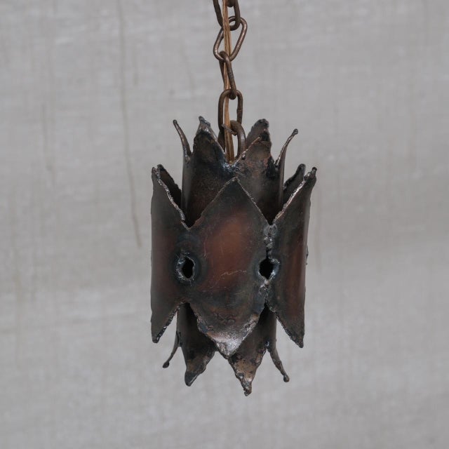 A set of three brutalist style wall lights. In the manner of Sven Aage Holm Sørensen. Sweden, c1970s. Patinated metal....