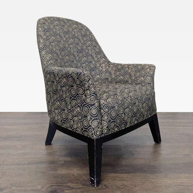 This lounge chair features a unique black and tan swirl pattern upholstery, adding a stylish touch to any room. The chair...