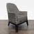 This lounge chair features a unique black and tan swirl pattern upholstery, adding a stylish touch to any room. The chair...