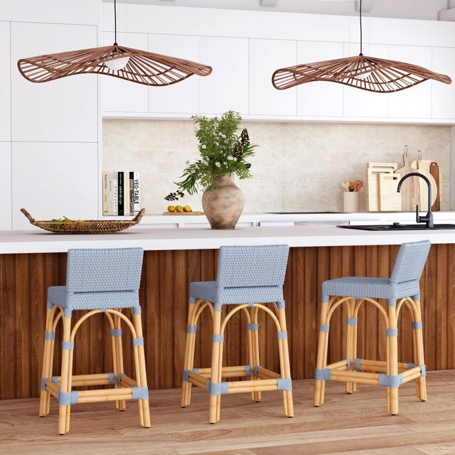 Combining clean lines with tropical materials, this Butler Specialty Company stylish low back counter stool infuses modern...