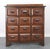 A classic example of an antique apothecary cabinet, also frequently used as a library card catalog or seed counter. These...