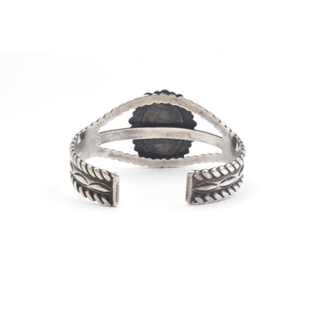 Native American Style sterling silver and agate cuff bracelet. Bracelet design features a central oval piece of agate in a...