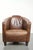 this robust cognac-colored cowhide Aviator design armchair with a striking and timeless appearance. This robust, cognac-...