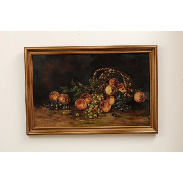 An American still-life oil painting from the 19th century depicting fruits and set in gilt frame. Created in the US during...