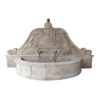 A Grand Carved Limestone 2-Spout Italian Villa Wall Fountain With Arched Basin For Sale