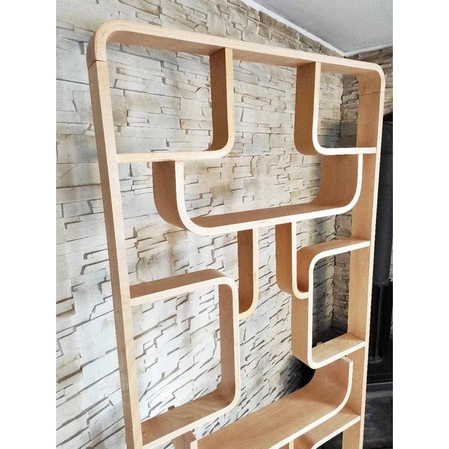 A wall designed by Ludvík Volák, produced in the 1960s in Czechoslovakia by Dřevopodnik Holešov. It is made of bent wooden...