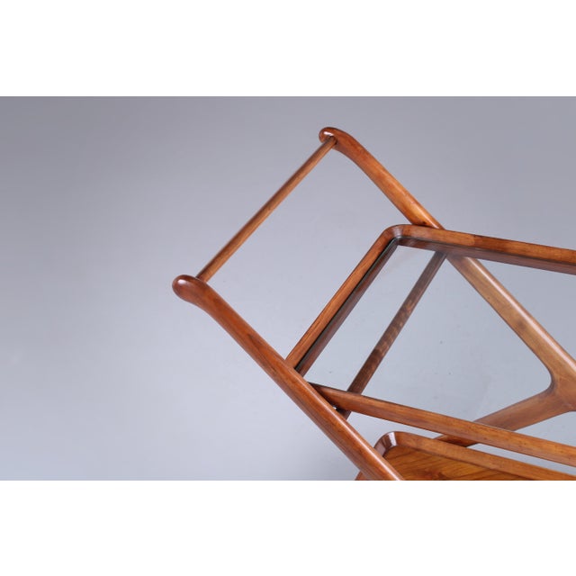 Great Italian style Serving Trolley, original from the 1960ies. This elegant trolley is defined by its organic lines and...