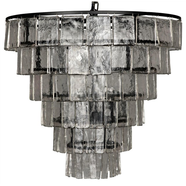 Glass paillettes drip ostentatiously down the outside of this stunning, sparkling chandelier. Bulb Quantity: 8 Socket: E12...