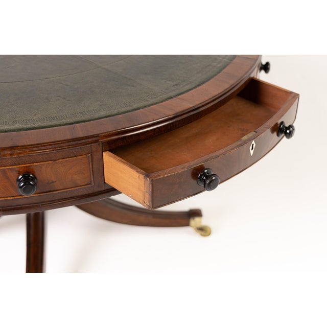 Large 19th century english mahogany drum table a grand, early 19th century english regency mahogany drum table of large...