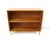 A Mid Century solid maple wood bookcase with one nonadjustable shelve sitting on square tubed stainless steel legs....