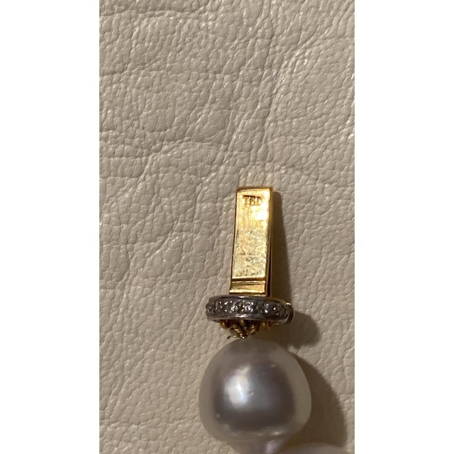 Vintage South Sea Baroque Pearl necklace with 18k yellow gold barrel clasp with small diamonds. Marked 750 for 18 K....