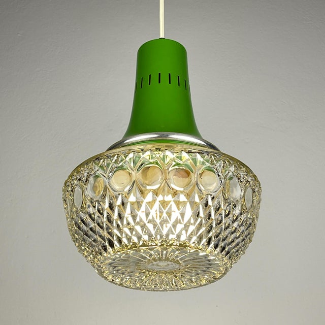 Amazing mid-century chandelier by targetti sankey made in italy in the 1960s. thick glass decorated with an ornament is...