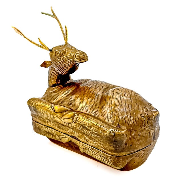 A striking mid-century heavy brass figural trinket box retailed by the legendary J.W. Robinson's department store, modeled...