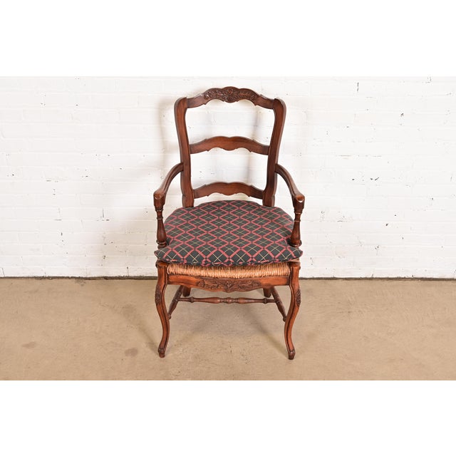 A gorgeous French Country or French Provincial Louis XV style armchair or dining captain chair By Baker Furniture USA,...