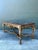 This monumental 19th-century French Rococo console table is a breathtaking showcase of European opulence and artisanal...