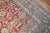 An early 20th century Persian Bibikabad oversize rug with an elegant allover design in beige, pink and gray on a soft red...