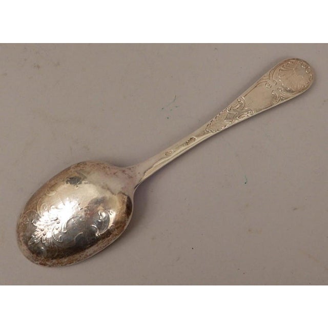 Period Louis XVI sterling table spoon, Paris, 1789 A tour de force of the Louis XVI style with applied medallion handle....