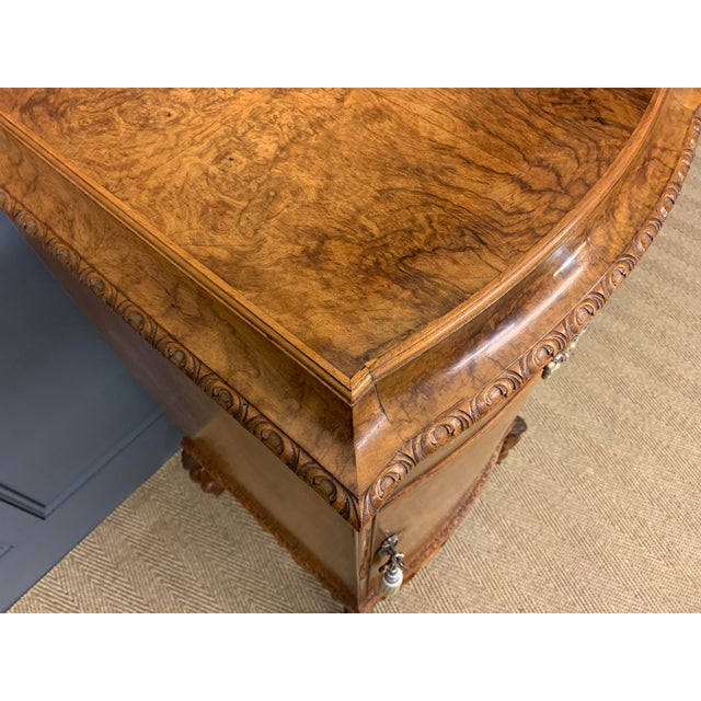 A bold and impressive pair of burr walnut pedestal cupboards in the queen Anne style. Of large size and of very good...