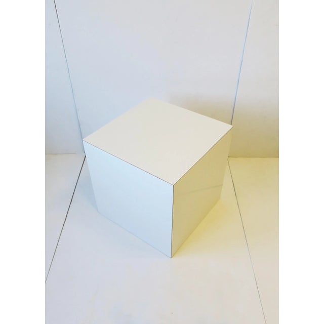 A white gloss laminate veneered pedestal or cube end table, '70s Modern/Postmodern design period, circa late-20th century,...