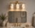 Bring warmth and natural character to the wall with this handcrafted 3-light brass vanity sconce, featuring three softly...