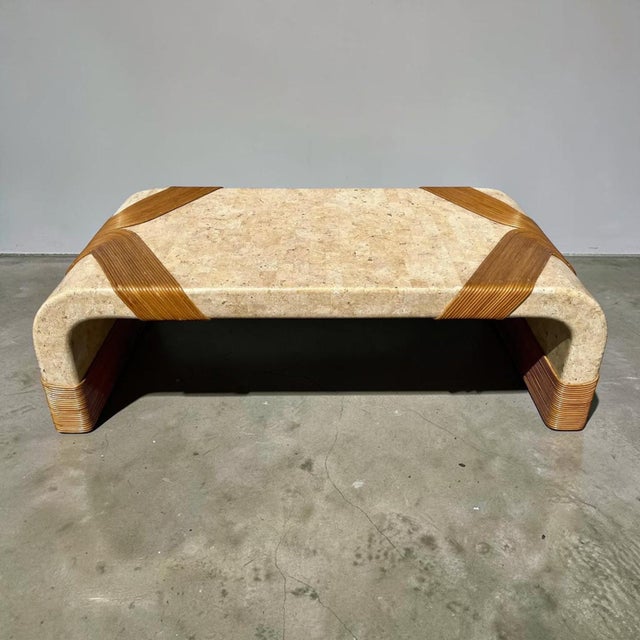 Very rare and unique tessellated marble coffee table wrapped in organic pencil reed rattan. Original owner said they were...